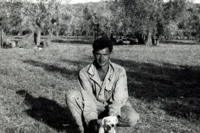 Jesse Willard and dog named 'Maggie' in North Africa.